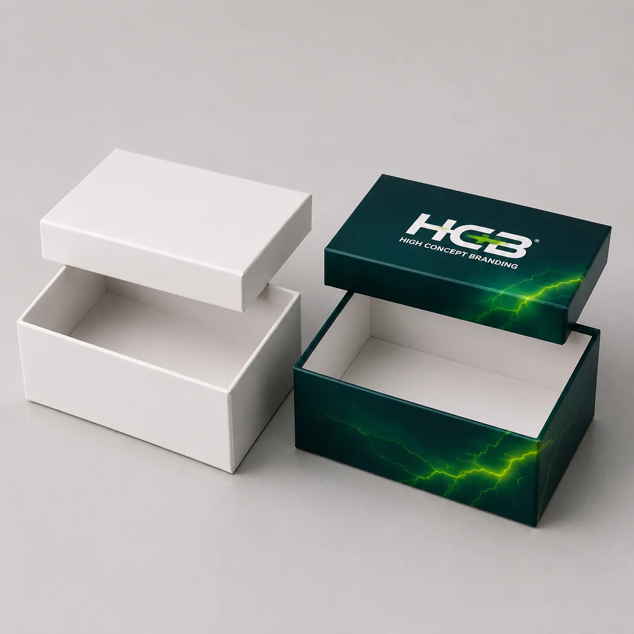 Custom printed two piece rigid lid and base boxes for vape batteries next to plain sample. class=